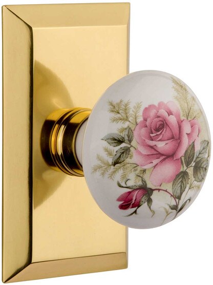 New York Rosette Door Set with Rose Porcelain Knobs in Polished Brass.